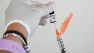 FILE - In this Tuesday, Sept. 21, 2021 file photo, a nurse loads a syringe with the Pfizer COVID-19 vaccine in Jackson, Miss. Millions of Americans are now eligible to receive a Pfizer booster shot to help increase their protection against the worst effects of the coronavirus.