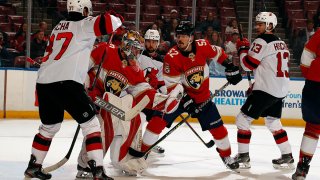 SUNRISE, FL - NOVEMBER 18: Goaltender Spencer Knight #30 of the Florida Panthers makes a glove save during first period action against the New Jersey Devils at the FLA Live Arena on November 18, 2021 in Sunrise, Florida. (Photo by Eliot J. Schechter/NHLI via Getty Images)