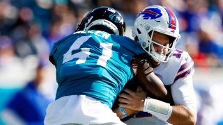 Jacksonville Jaguars outside linebacker Josh Allen (41) sacks Buffalo Bills quarterback Josh Allen (17) in the first half at TIAA Bank Field.