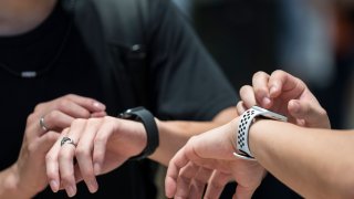 Customers try Apple Watch devices in the Apple Marunouchi store on September 07, 2019 in Tokyo, Japan.