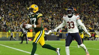 Davante Adams #17 of the Green Bay Packers scores on a 38-yard touchdown reception past Jaylon Johnson #33 of the Chicago Bears during the second quarter of the NFL game at Lambeau Field on December 12, 2021 in Green Bay, Wisconsin.