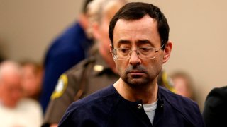 Former Michigan State University and USA Gymnastics doctor Larry Nassar addresses the court during the sentencing phase in Ingham County Circuit Court on January 24, 2018 in Lansing, Michigan. Disgraced former USA Gymnastics doctor Larry Nassar was sentenced to 40 to 175 years in prison on Wednesday for sexually abusing scores of young girls under the guise of medical treatment. "I've just signed your death warrant," Judge Rosemarie Aquilina said as she handed down the sentence after a week of gut-wrenching testimony by over 150 of Nassar's victims.