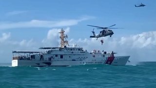 File image of a U.S. Coast Guard boat and helicopters