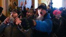 Jon Schaffer, in blue, breaches the Capitol Building with other members of the Oath Keepers militia and other Trump supporters on Jan. 6, 2021. Schaffer was the first to plead guilty for the events of the day.