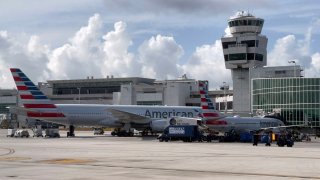 American Airlines planes are seen at the gates at Miami International Airport (MIA) on August 1, 2021 in Miami, Florida. (Photo by Daniel SLIM / AFP) (Photo by DANIEL SLIM/AFP via Getty Images)