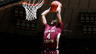 WEST LAFAYETTE, IN – NOVEMBER 30: Florida State Seminoles guard Caleb Mills (4) dunks against the Purdue Boilermakers on November 30, 2021 at Mackey Arena in West Lafayette, Indiana. (Photo by Brian Spurlock/Icon Sportswire via Getty Images)