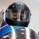 Elana Meyers Taylor, of United States, drives during the Women's Monobob heat 1 at the 2022 Winter Olympics, Feb. 13, 2022, in the Yanqing district of Beijing, China.