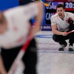 Canada's Brett Gallant yells to a sweeper during a Men's Curling Match against the United States at the 2022 Winter Olympics Feb. 13, 2022, in Beijing, China.