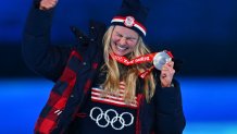 Silver medallist USA's Jessie Diggins celebrates her silver medal during the cross-country skiing women's 30km mass start victory ceremony at the 2022 Winter Olympic Games Closing Ceremony, Feb. 20, 2022, Beijing.