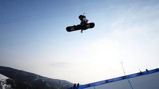Chloe Kim of United States performs a trick during the Women's Snowboard Cross Qualification on Day 5 of the Beijing 2022 Winter Olympic Games at Genting Snow Park on February 09, 2022 in Zhangjiakou, China.