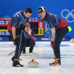 (L-R) John Landsteiner, John Shuster and Matt Hamilton of Team United States compete during the Men's Curling Round Robin Session against Team Canada on day 9 of the 2022 Winter Olympics at National Aquatics Centre on Feb. 13, 2022, in Beijing, China.