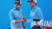 Christopher Plys and John Shuster of Team United States celebrate a win against Team Switzerland during the Men’s Curling Round Robin Session 9 on day 11 of the 2022 Winter Olympics at National Aquatics Centre on Feb. 15, 2022, in Beijing, China.