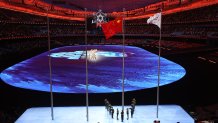 The flag of China and the flag of the IOC are raised during the Beijing 2022 Winter Olympics Closing Ceremony, Feb. 20, 2022 in Beijing, China.
