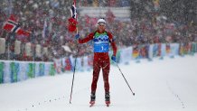 Ole Einar Bjoerndalen of Norway crosses the finish line to win the gold medal in the men's 4 x 7.5 km biathlon relay