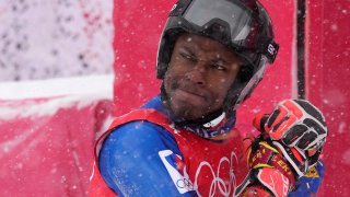 Richardson Viano, of Haiti reacts after finishing the first run of the men's giant slalom at the 2022 Winter Olympics, Feb. 13, 2022, in the Yanqing district of Beijing.