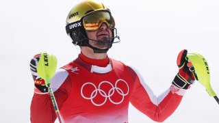 Austria's Johannes Strolz celebrates winning the men's combined gold medal at the 2022 Winter Olympics.