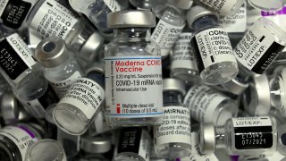 FILE: Empty vials of different vaccines by Moderna, Pfizer-BioNTech and AstraZeneca against Covid-19 caused by the novel coronavirus are pictured at the vaccination center in Rosenheim, southern Germany, on April 20, 2021, amid the novel coronavirus.