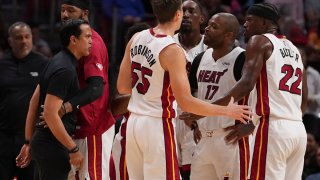 MIAMI, FLORIDA – MARCH 23: Head coach Erik Spoelstra of the Miami Heat yells at Jimmy Butler #22 during a timeout in the second half against the Golden State Warriors at FTX Arena on March 23, 2022 in Miami, Florida. NOTE TO USER: User expressly acknowledges and agrees that, by downloading and or using this photograph, User is consenting to the terms and conditions of the Getty Images License Agreement. (Photo by Eric Espada/Getty Images)