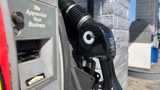 A gasoline pump at a station in San Diego, March 26, 2022.
