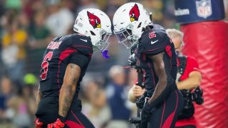 Arizona Cardinals running back James Conner (6) celebrates a touchdown with running back Chase Edmonds (2) against the Green Bay Packers at State Farm Stadium.
