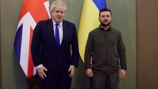 In this image provided by the Ukrainian Presidential Press Office, Britain’s Prime Minister Boris Johnson, left and Ukrainian President Volodymyr Zelenskyy pose for a photo, in Kyiv, Ukraine, Saturday, April 9, 2022.