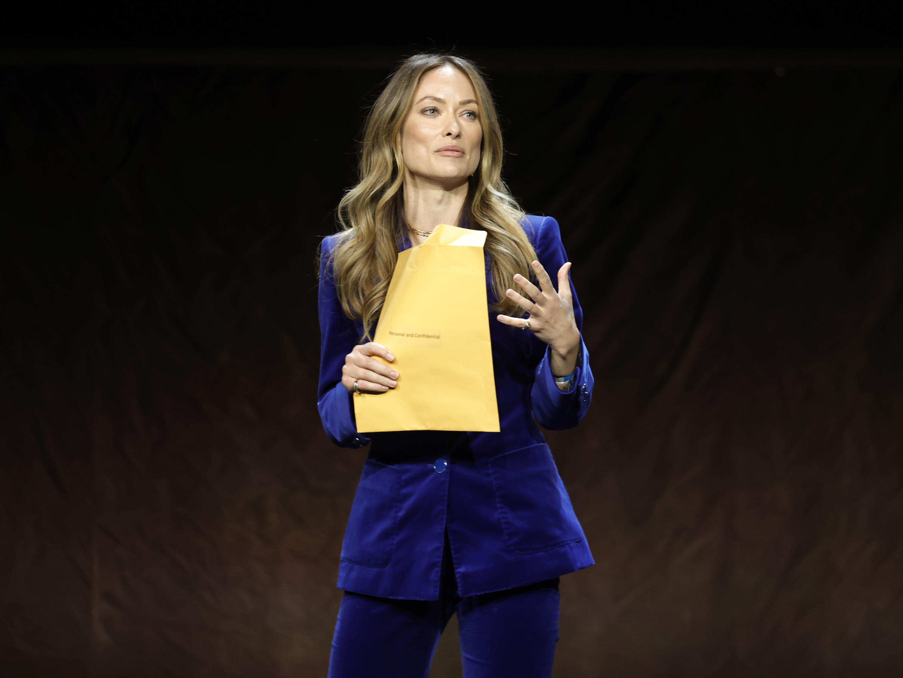 Olivia Wilde Receives Jason Sudeikis’ Custody Papers Onstage at CinemaCon
