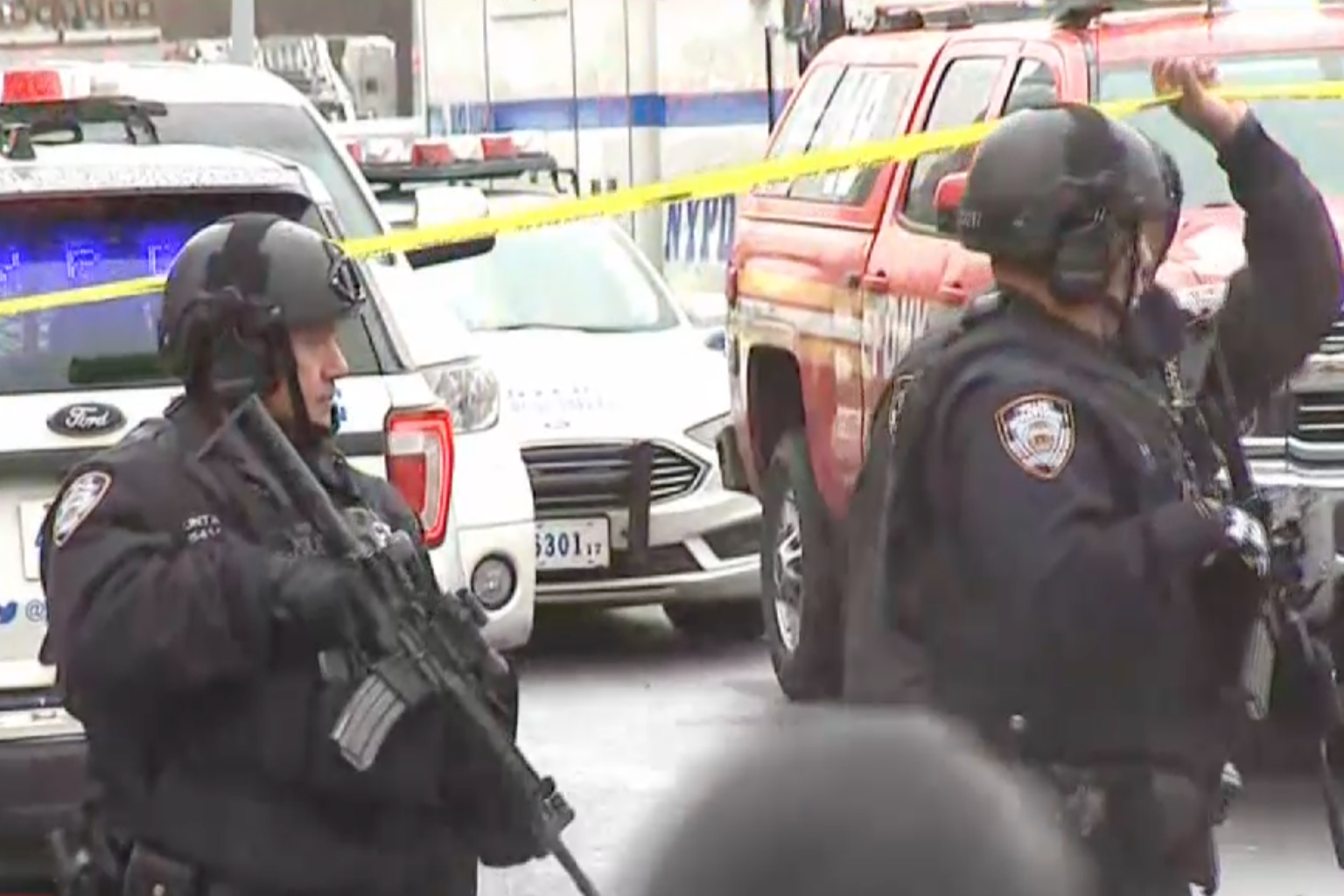 Police and first responders swarm the Brooklyn neighborhood of Sunset Park in New York, after multiple people were shot or hurt at the height of morning rush hour, April 12, 2022.