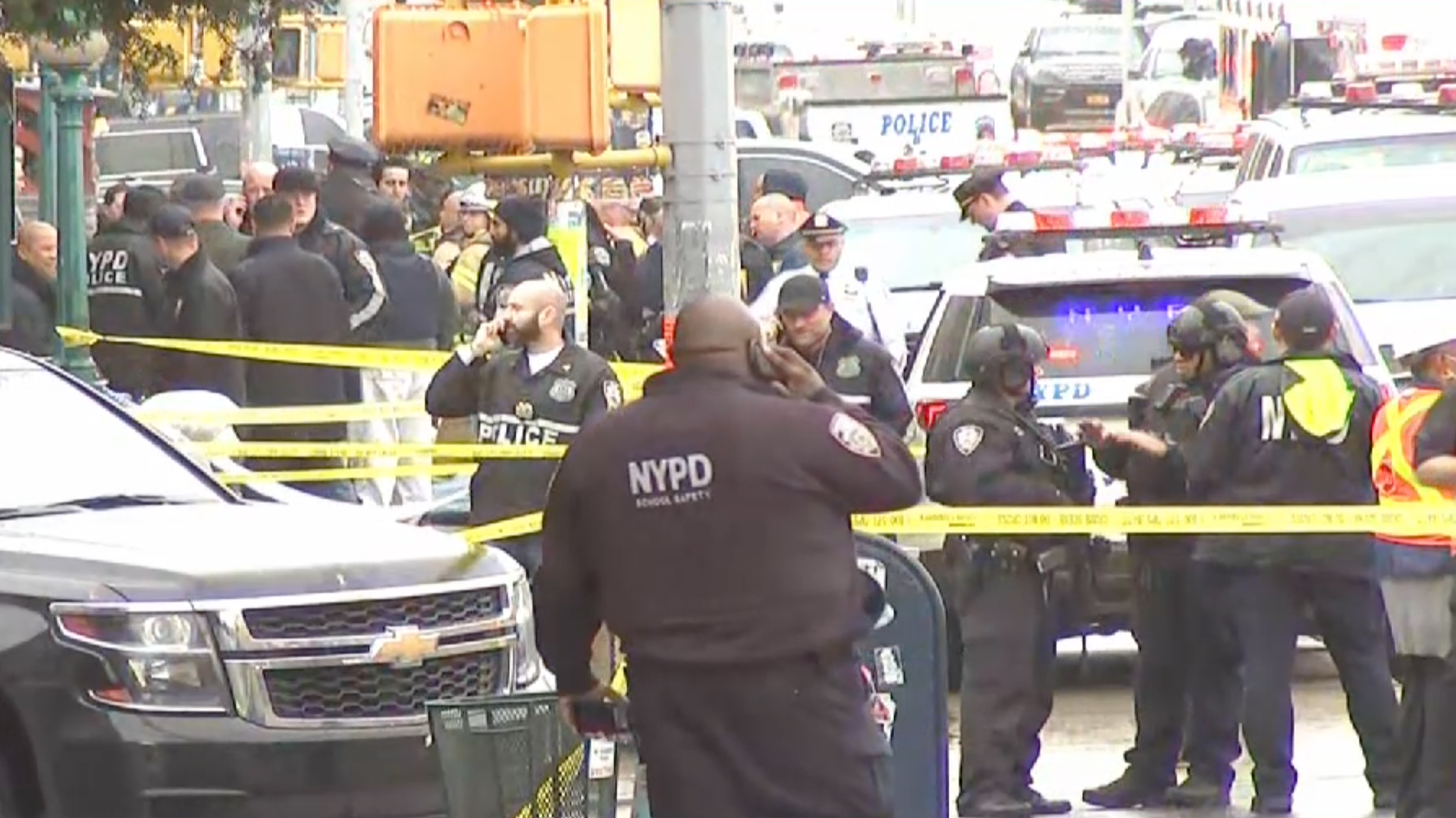 Police and first responders swarm the Brooklyn neighborhood of Sunset Park in New York, after multiple people were shot or hurt at the height of morning rush hour, April 12, 2022.