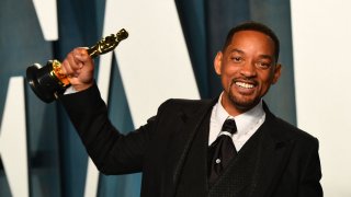 US actor Will Smith holds his award for Best Actor in a Leading Role for “King Richard” as he attends the 2022 Vanity Fair Oscar Party following the 94th Oscars at the The Wallis Annenberg Center for the Performing Arts in Beverly Hills, California on March 27, 2022.