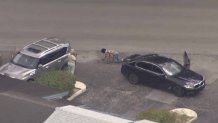 A suspect surrenders to police in Miramar after a high-speed chase that began in Miami-Dade.