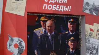 Russian President Vladimir Putin is seen on the screen as he delivers a speech during 77th anniversary of the Victory Day in Red Square in Moscow, Russia on May 09, 2022.