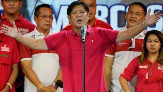 Ferdinand "Bongbong" Marcos Jr. gestures as he greets the crowd during a campaign rally in Quezon City, Philippines on April 13, 2022. Marcos Jr., son of the late dictator and his running mate Sara, who is the daughter of the outgoing President Rodrigo Duterte, are leading pre-election surveys despite his family's history.