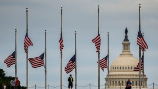 American flags surrounding the Washington Monument are seen at half-staff on May 25, 2022, in Washington, D.C., in honor of the victims of a deadly mass shooting at an elementary school in Uvalde, Texas.
