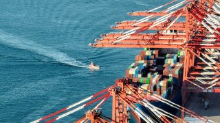 Aerial view of shipping containers and cranes at Qingdao Port on May 30, 2022 in Qingdao, Shandong Province of China.