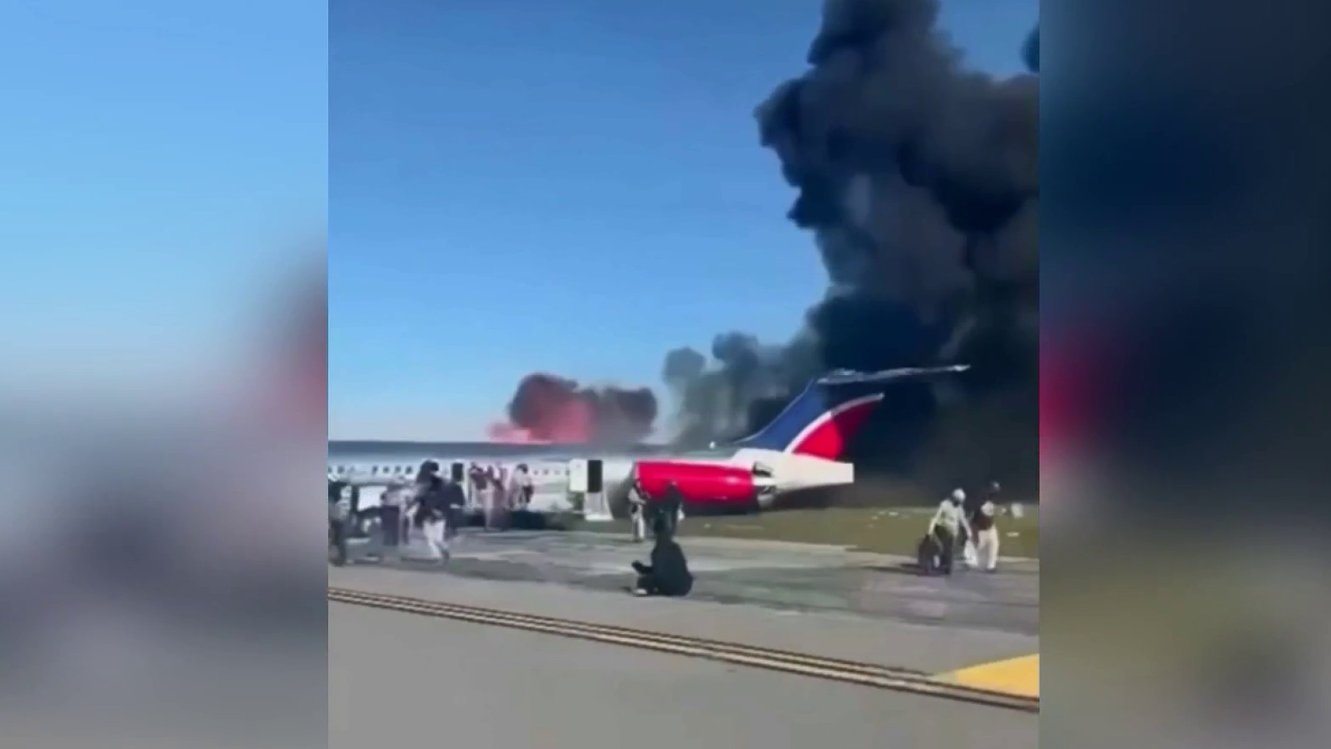Plane Full of Passengers Catches on Fire at photo image
