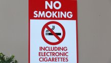 A sign reads "No Smoking Including Electronic Cigarettes" is displayed on a wall in Las Vegas, Nevada.