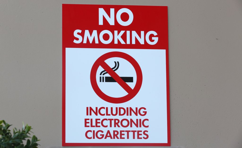 A sign reads "No Smoking Including Electronic Cigarettes" is displayed on a wall in Las Vegas, Nevada.