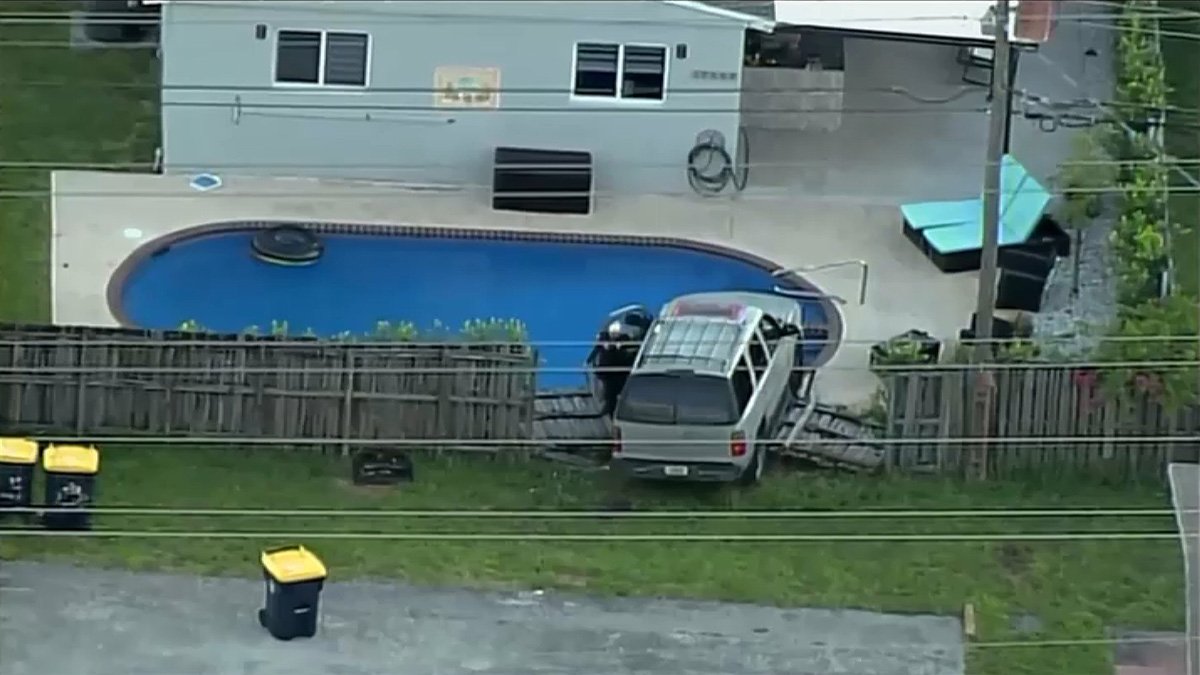 SUV Plows Through Fence, Nearly Ends Up in Backyard Pool at Dania Beach ...