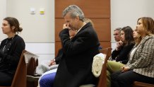 Max Schachter, the father of victim Alex Schachter, reacts as Dr. Rebecca MacDougall, the Chief Medical Examiner for Broward County Florida describes the gunshot his son sustained in the mass shooting. Marjory Stoneman Douglas High School shooter Nikolas Cruz is being tried in the penalty phase of his trial at the Broward County Courthouse in Fort Lauderdale on Tuesday, July 26, 2022. Cruz previously plead guilty to all 17 counts of premeditated murder and 17 counts of attempted murder in the 2018 shootings. (Mike Stocker/South Florida Sun Sentinel via AP, Pool)