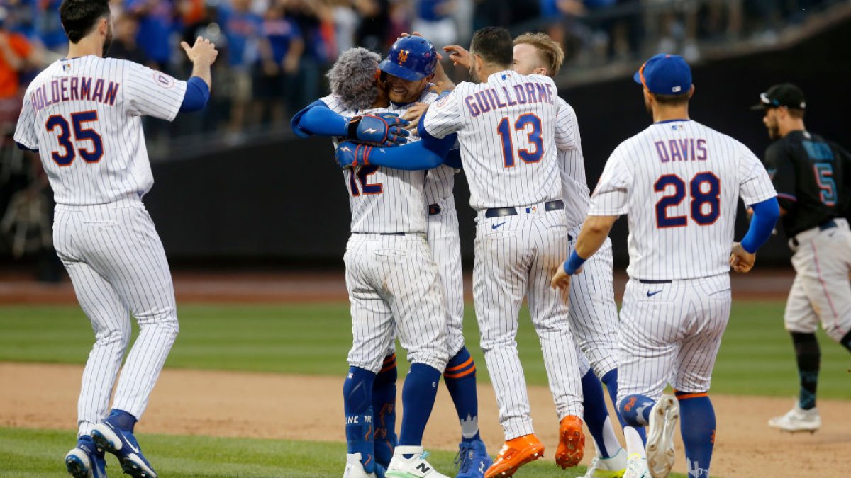Nido helps banged-up Mets rally past Marlins 5-4 in 10