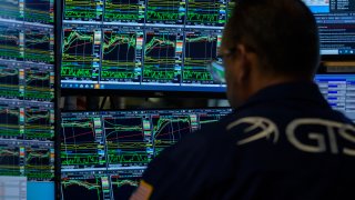 Traders work on the New York Stock Exchange (NYSE) at Wall Street in New York City.