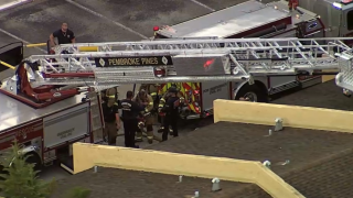 A woman was hospitalized after a fire broke out in the attic of a home in Pembroke Pines on Wednesday, Aug. 17, 2022