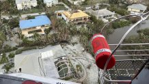 U.S. Coast Guard aircrew hoists people from flooded areas near Sanibel, Florida in the wake of Hurricane Ian, Sept. 29, 2022.