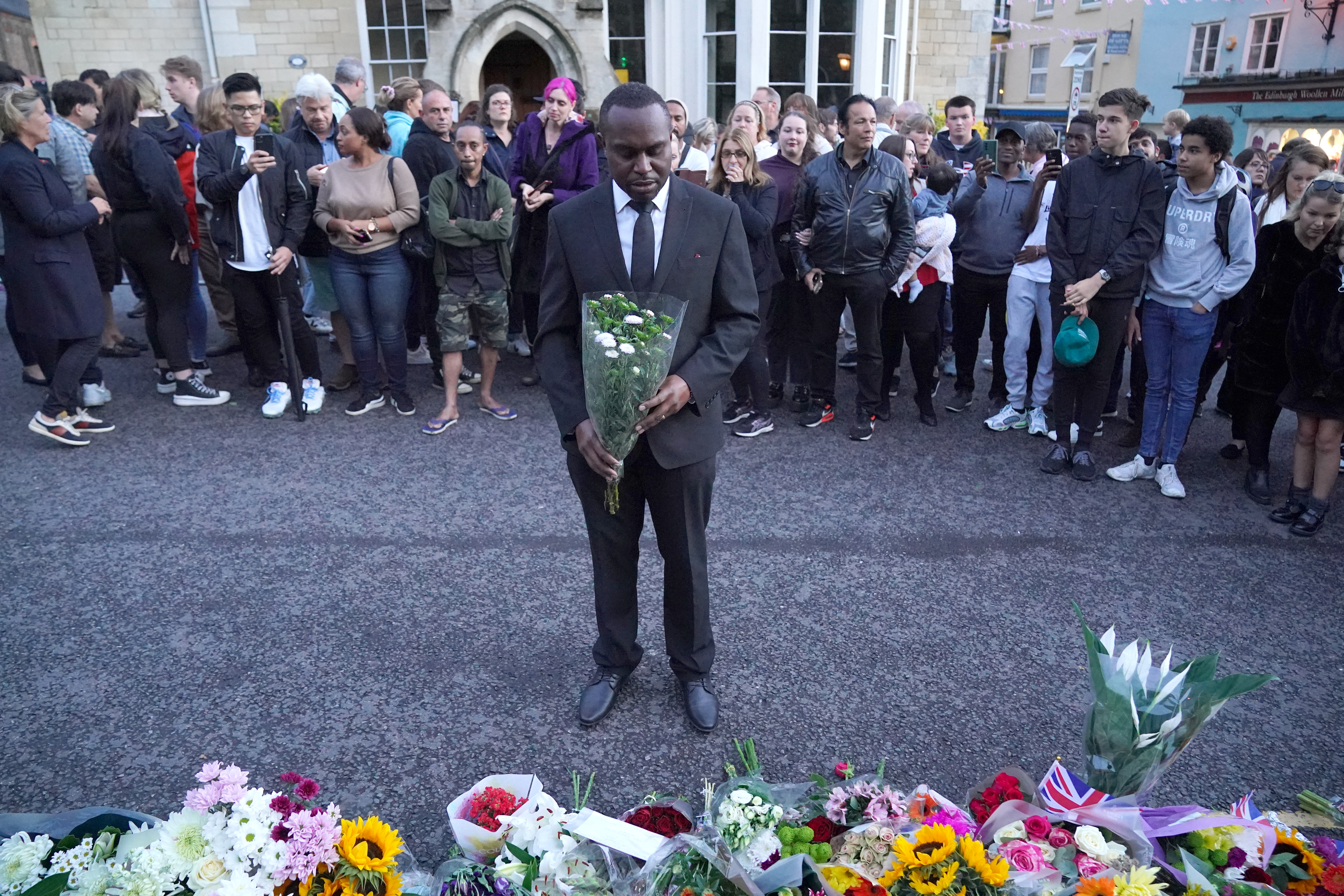 Mourners gather laying flowers outside Windsor Castle in Berkshire following the announcement of the death of Queen Elizabeth II. Picture date: Thursday September 8, 2022.