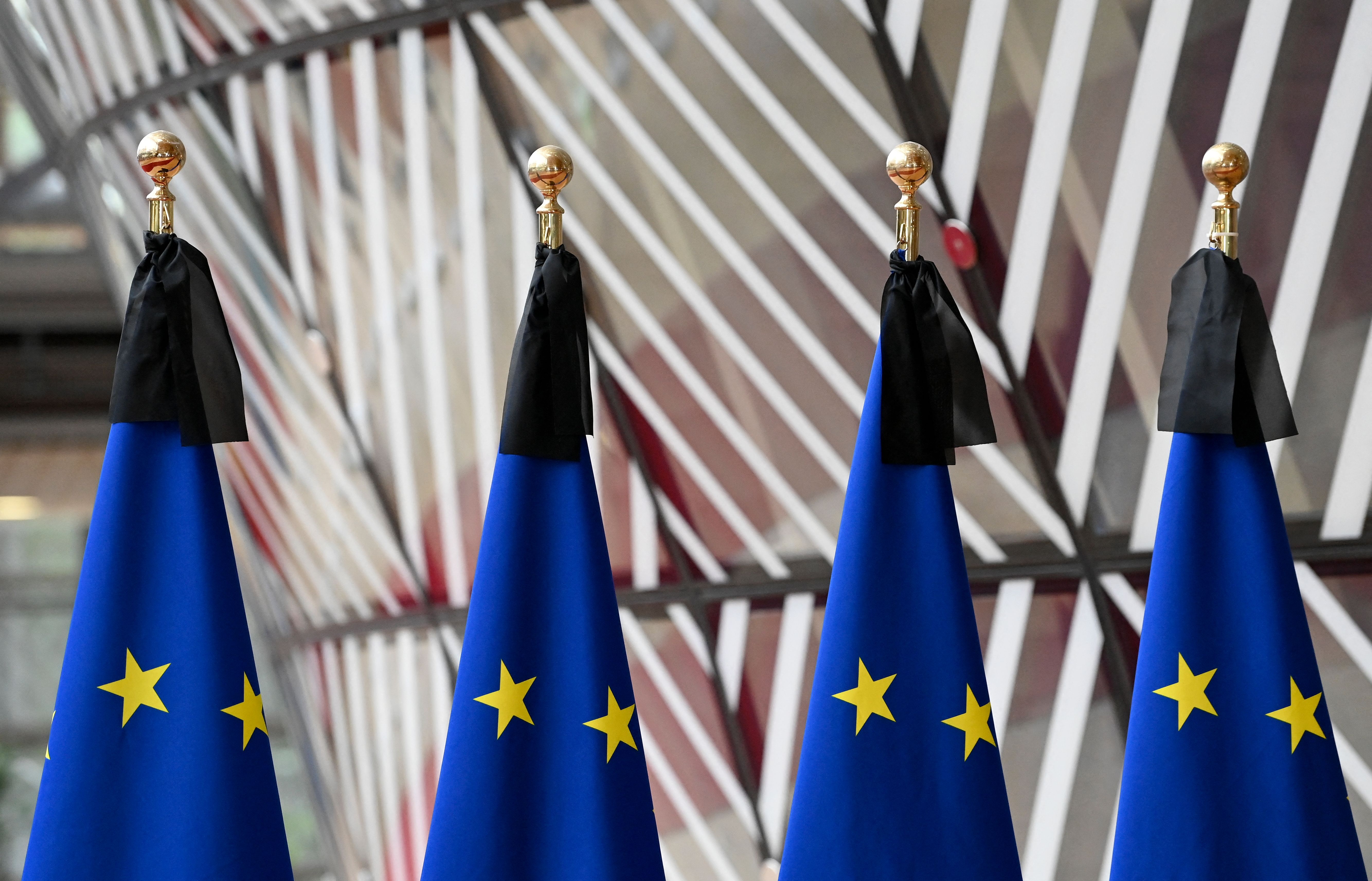 European flags fly at half-mast during a meeting of EU energy ministers at the EU headquarters in Brussels, Sept. 9, 2022, a day after the death of Britain’s Queen Elizabeth II.