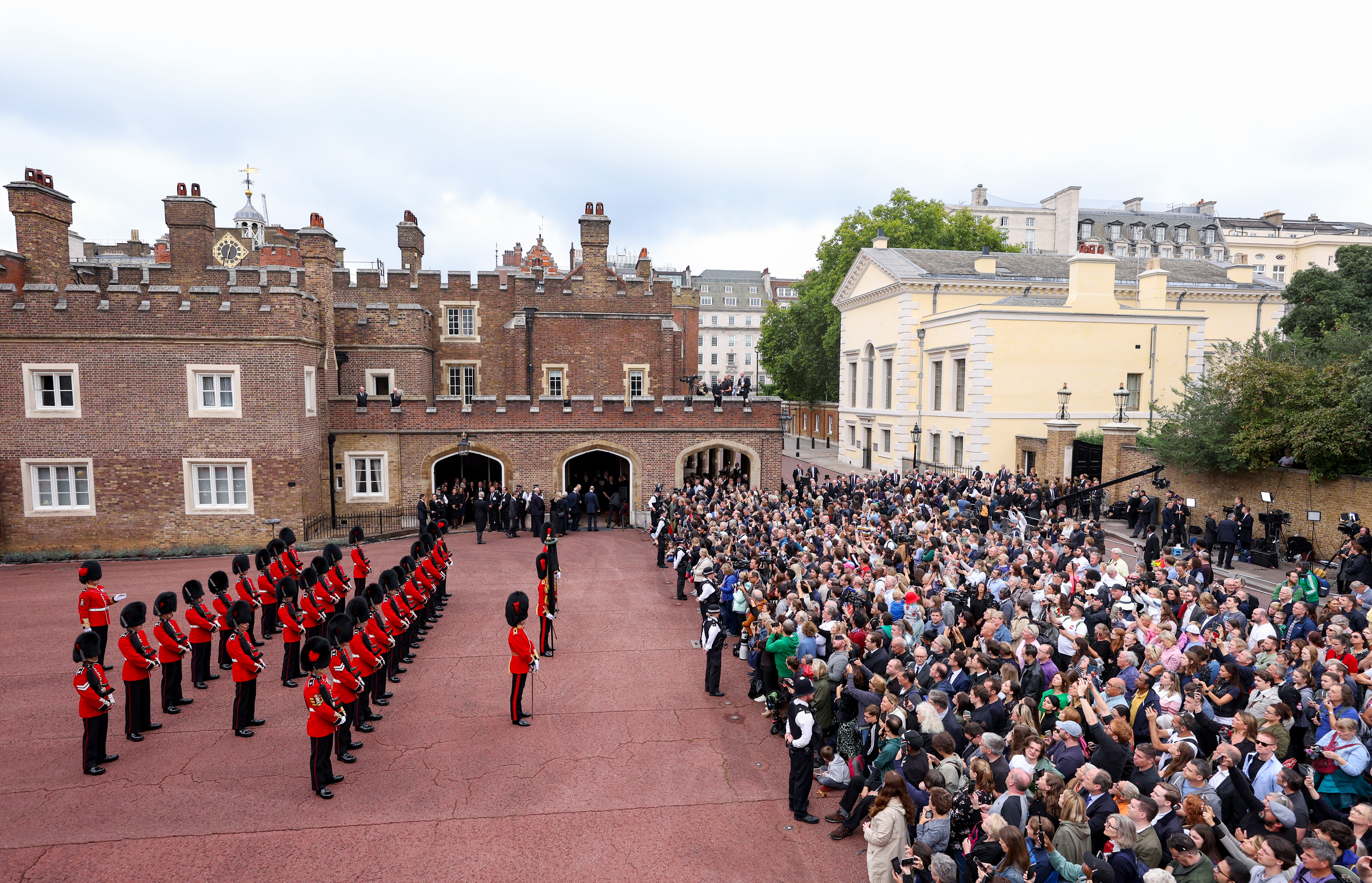 Members of the Coldstream guards line up ahead of the watching public as the Principal Proclamation is read from the balcony overlooking Friary Court after King Charles III is proclaimed King, at St James’s Palace in London, England, Sept. 10, 2022.