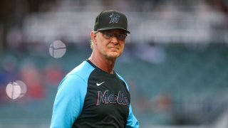 Don Mattingly #8 of the Miami Marlins makes a pitching change against the Atlanta Braves in the eighth inning at Truist Park on September 4, 2022 in Atlanta, Georgia.