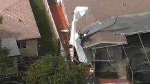 A small plane crashes into a house in Miramar on Oct. 17, 2022.