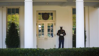 A United States Marine stands guard in front of the west wing, signalling that U.S. President Trump has entered the west wing at the White House, following the 2020 U.S. presidential election in Washington, U.S., November 6, 2020.