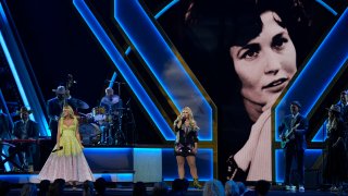 Carrie Underwood, left, and Miranda Lambert perform a tribute to the late singer Loretta Lynn, pictured on screen, during the 56th Annual CMA Awards on Wednesday, Nov. 9, 2022, at the Bridgestone Arena in Nashville, Tenn.